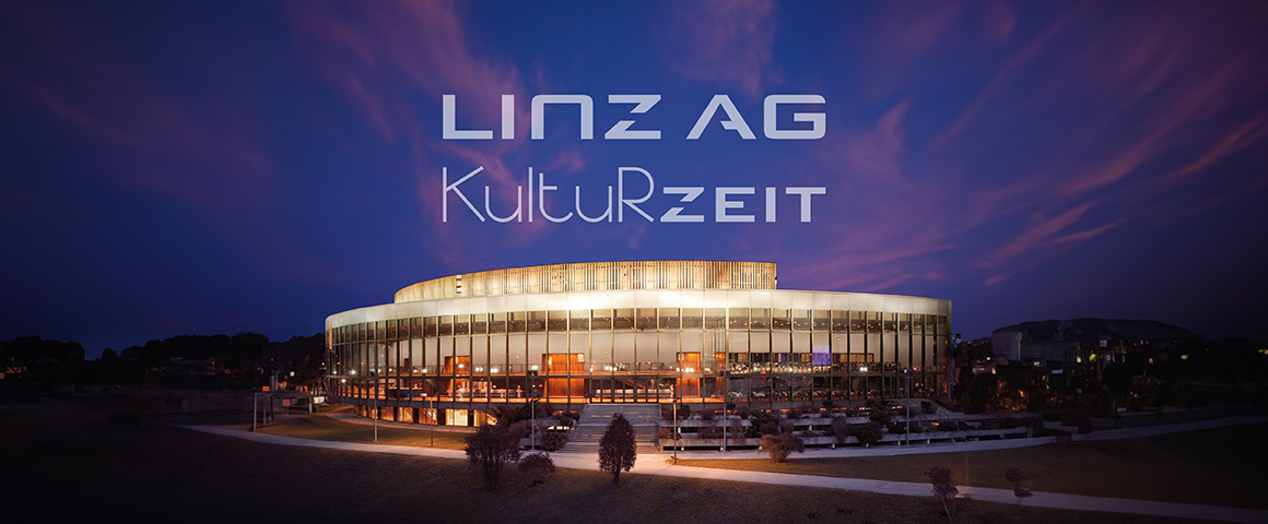 Nachtaufnahme vom Brucknerhaus Linz mit Schriftzug Linz AG Kulturzeit